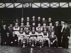 Ferryhill Athletic team photo in front of the Clock Stand Roker Park circa 1930. By kind permission of Geoff Wall